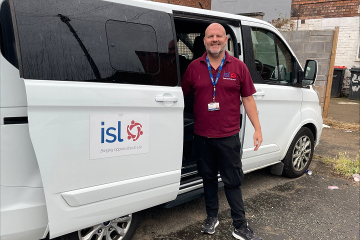 Image of Rapid Response Crisis Worker Next to a specialist PICU van