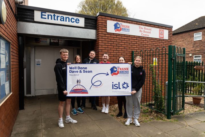 Foundation team await Dave and Seans arrival with a well done banner